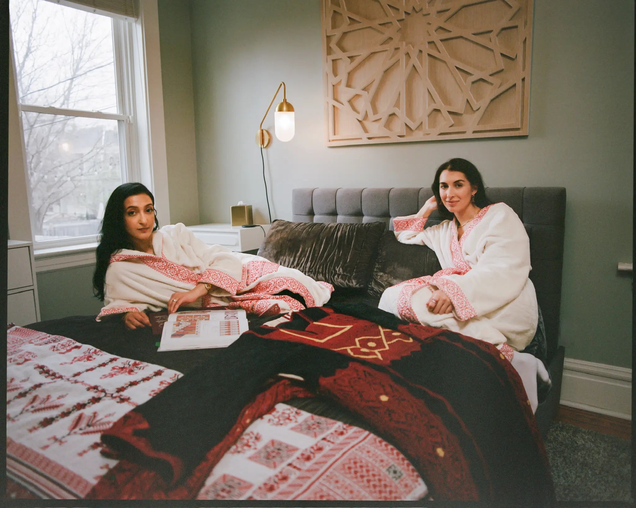 women in Throbez reading on bed